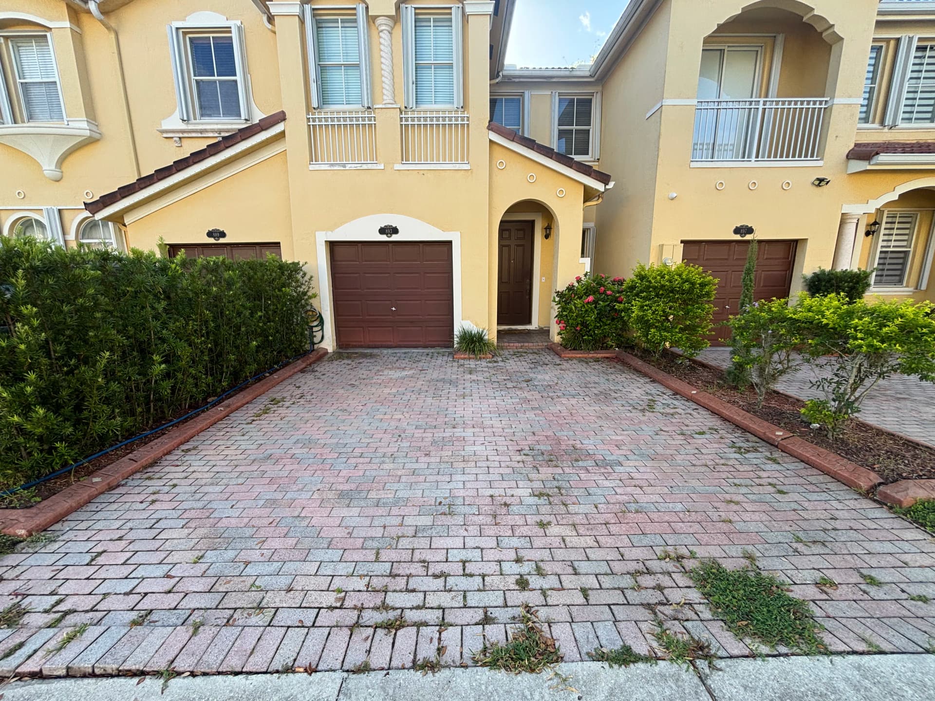 Paver Driveway Cleaned, Re-Sanded, and Sealed to Perfection image